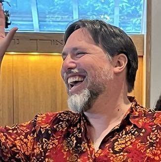 Rabbi Josh Breindel laughing during a service at Congregation Beth El