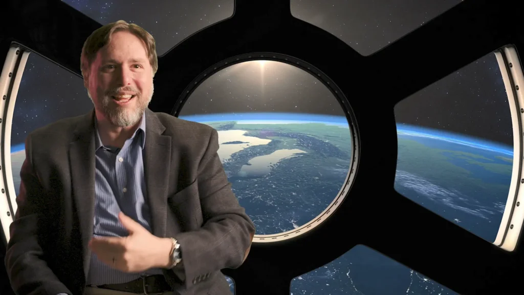 Rabbi Josh Breindel in a scene from Fiddler on the Moon: Judaism in Space, with Earth visible through a space station window