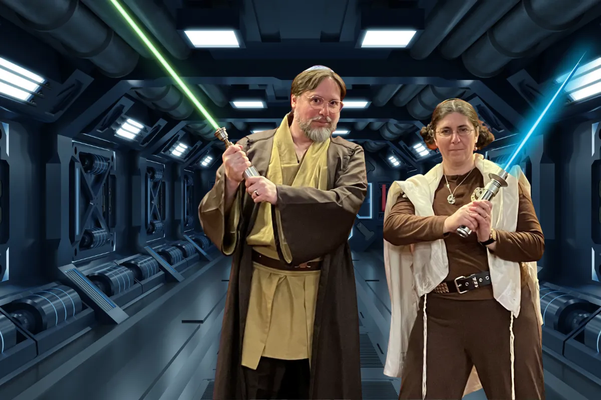 Rabbi Josh Breindel and Cantor Vera Broekhuysen in Jedi robes with green and blue lightsabers, promotional image for Star Wars Sunday at Congregation Beth El.